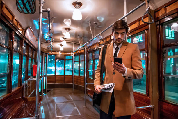 istock Elegant businessman using public transport 1197683907