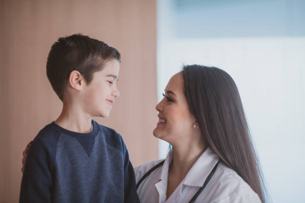 istock Pediatrician Talking With a Young Boy stock photo 1197684849