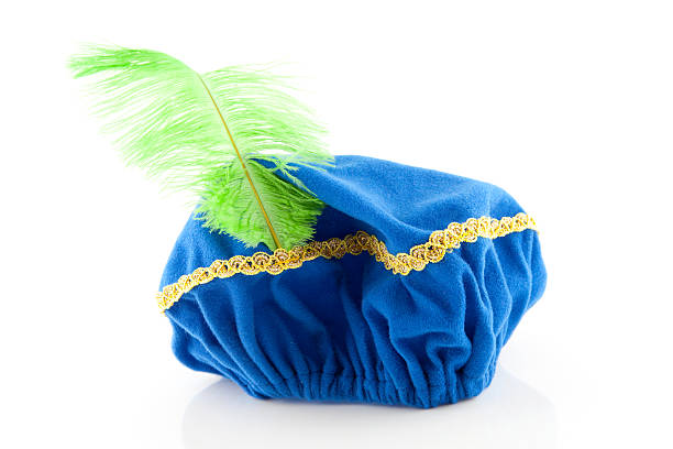 blue hat with green feather of Zwarte Piet  zwarte piet stock pictures, royalty-free photos & images