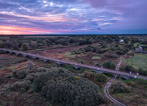 bridge over the river, autumn colors, sunrise and morning light, drone point of view, bridge Kasari in Estonia