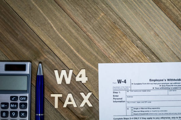 istock W4 Tax form Employee Withholding Certificate concept 1197690010