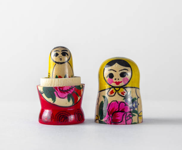 istock An open Russian traditional Russian doll toy inside which is another Russian doll, on a white background 1197691126