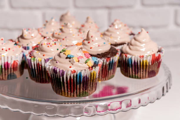 istock birthday cupcakes with colorful decorations on cake plate 1197691188