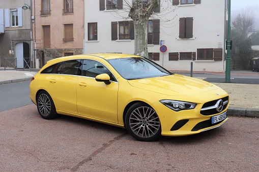 Yellow Mercedes CLA Shooting Brake 180 station wagon - Front right of the vehicle