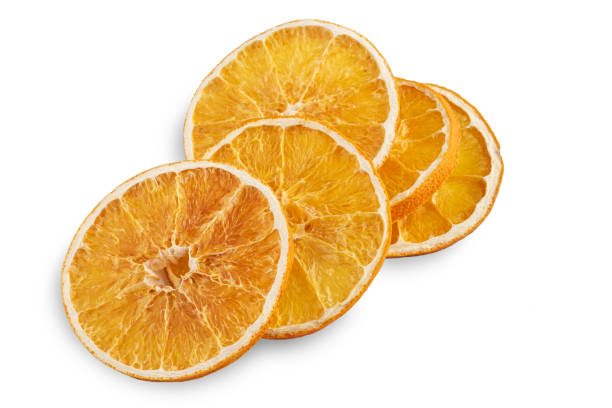 istock Stack of dried orange slices isolated on white 1197692611