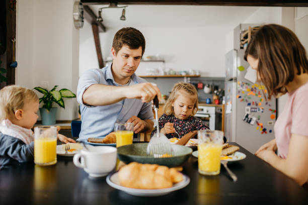 istock Young family is having breakfast together 1197694407
