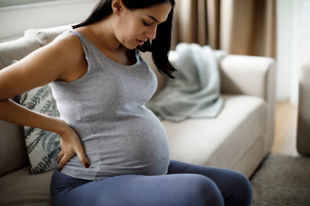 istock Young pregnant woman suffering from backache 1197694751