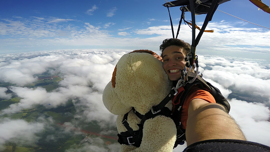 Skydiving tandem with a Teddy Bear