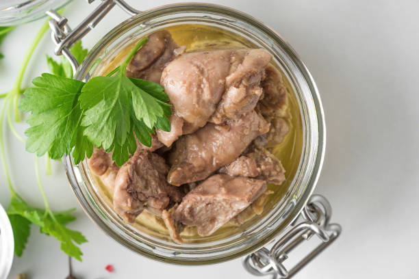 istock Cod liver in a jar with parsley. Natural source of omega 3 and vitamin D. top view 1197697430