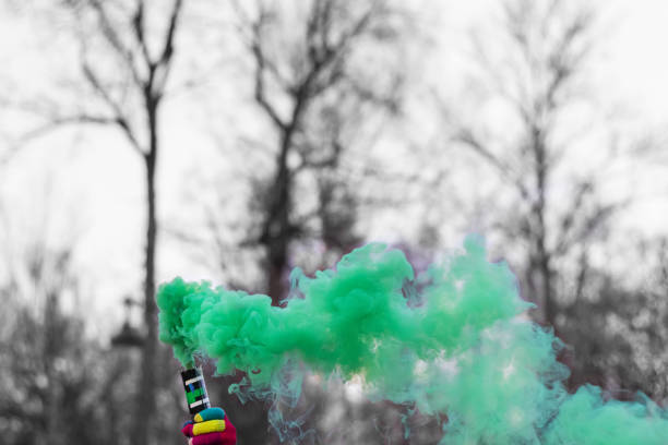 istock green colored smoke grenade in hand child 1197697587