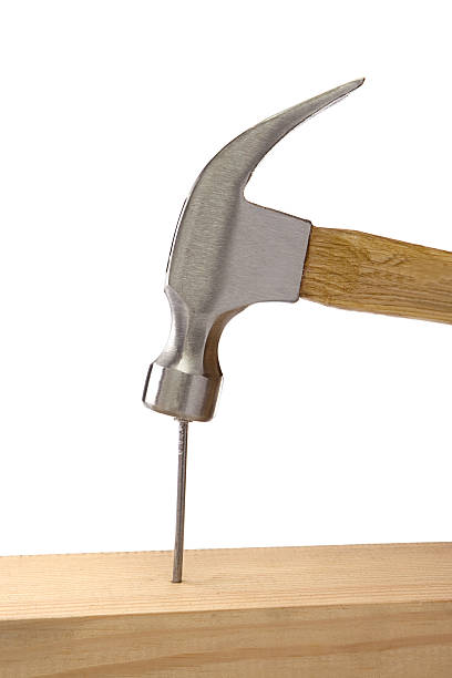 istock hammer and nail isolated on white 119769774