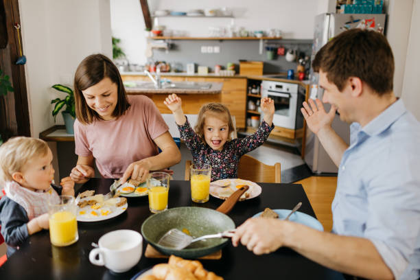 istock Excited daughter at the dinning table 1197697783
