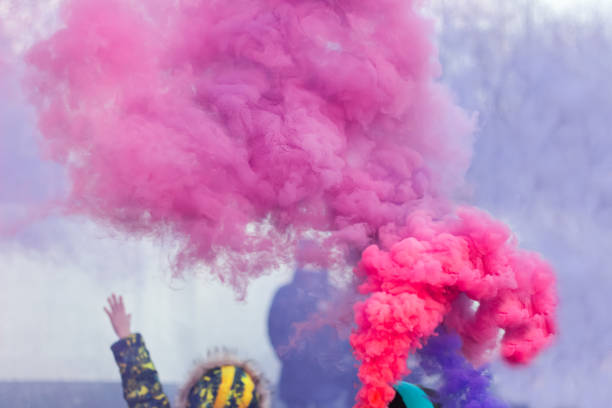 child is happy on holiday colored smoke bomb