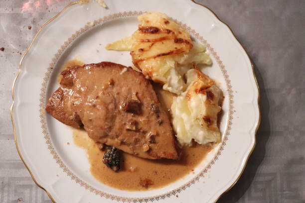 istock Roast veal with morels accompanied by gratin dauphinois 1197698677