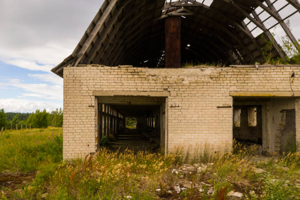 istock Drone view of abandoned rural concrete building during cloudy day. 1197698741