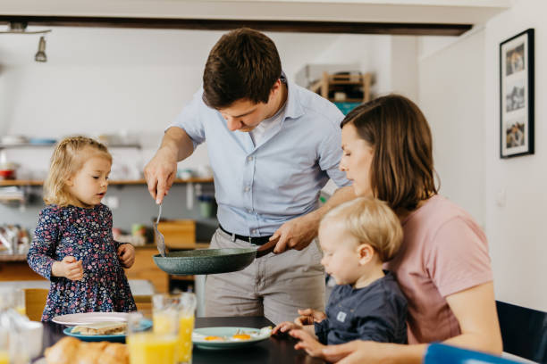 istock Young family is having breakfast together 1197698778