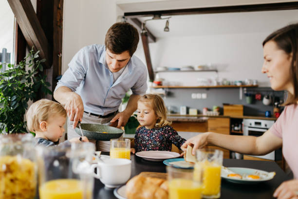 istock Young parents having brekfast with their children 1197698980