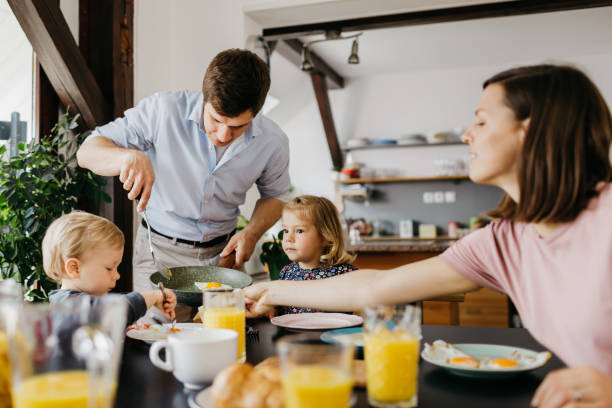 istock Young family is having breakfast together 1197700412
