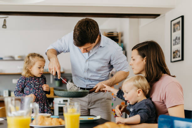 istock Young family is having breakfast together 1197701696
