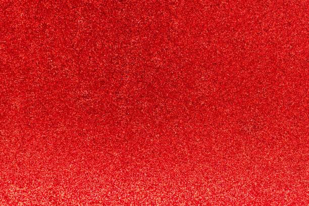 istock Festive abstract red glitter texture background. Colorful background with glittering and sparkling spots. Suitable for christmas, new year, chinese new year and designs. Selective focus 1197701740