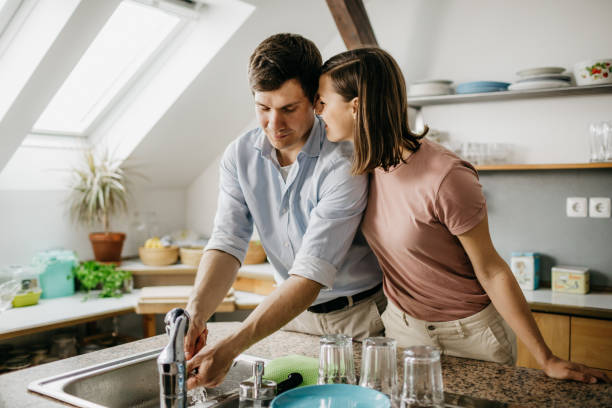 istock Husband washing the dishes 1197705773