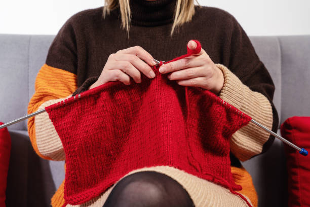 istock Handwork concept, young woman is knitting a needlework 1197705787
