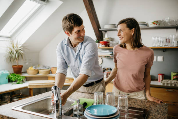 istock Husband washing the dishes 1197705812