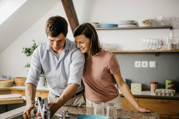 istock Husband washing the dishes 1197705838