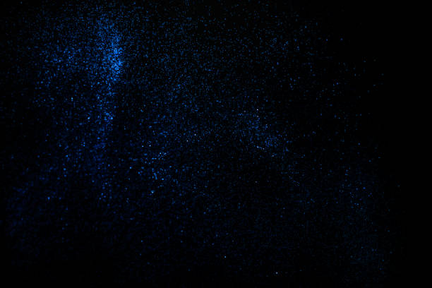 istock Blue glitter with a touch of blue on an isolated black background. 1197706770