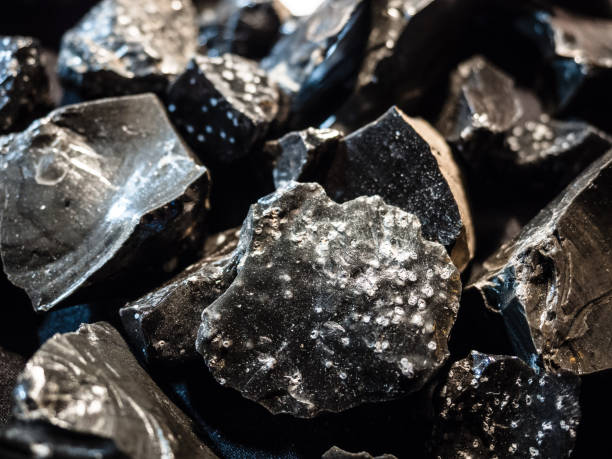 Background formed by pieces of graphite extracted from a mine.