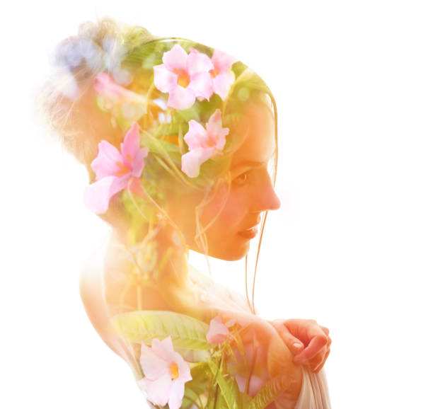 istock Multiple Exposure of woman morphing into flowers 1197710006