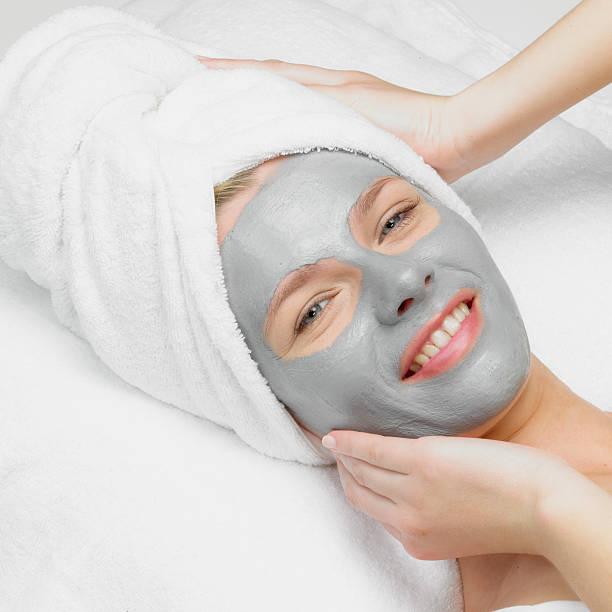 istock woman with facial mask 119771003