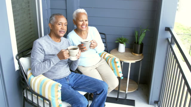 Senior African-American couple relaxing on porch