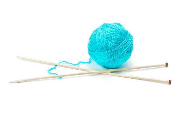 istock Ball of woolen thread and knitting needles isolated on white background. 1197710880