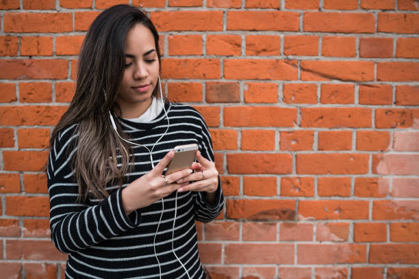 istock Young woman using her mobile phone. 1197716309