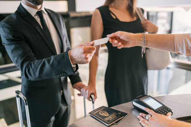 istock Business people makes card payment at check-in at reception. 1197716370