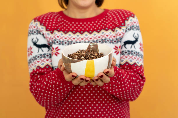 Young woman with muesli bowl
