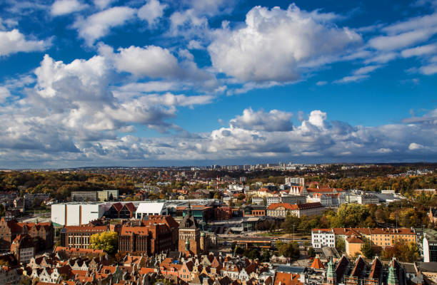 Beautiful blue cloudy sky above panorama of Gdansk, Poland. View from the tower of St. Mary's Basilica