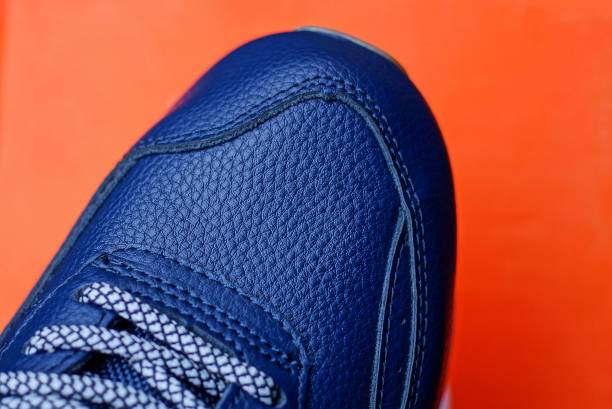istock part of one blue leather sneaker 1197726465