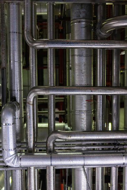 istock a complicated piping system, metal pipes 1197729183