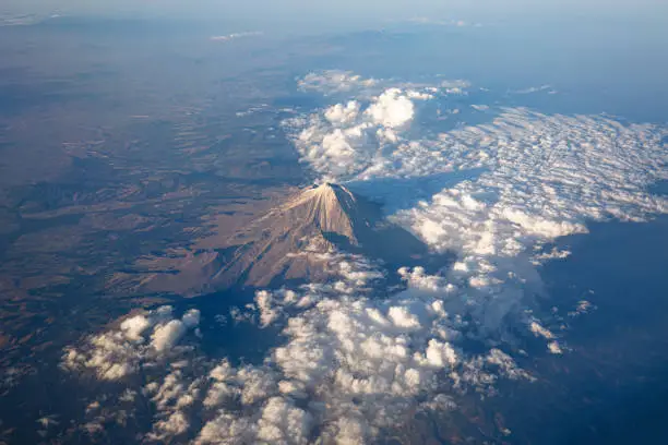 A scenic aerial view of Popocatepetl, a second highest peak in Mexico. It is an active stratovolcano, located in the states of Puebla, Morelos and Mexico, in central Mexico.