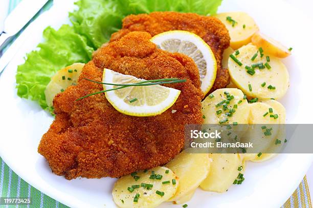 Overhead View Of A Wiener Schnitzel With Potato And Salad Stock Photo - Download Image Now