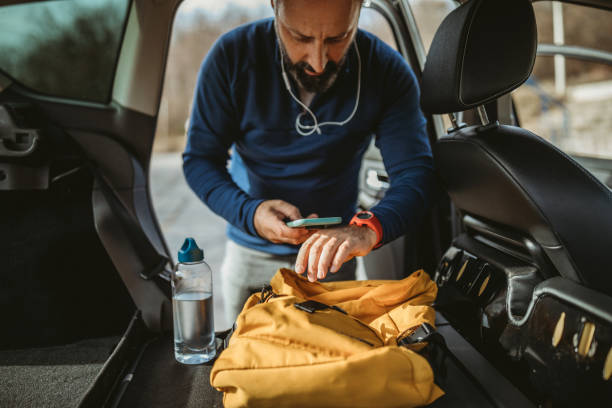 istock Senior man preparing mobile app for running 1197734561