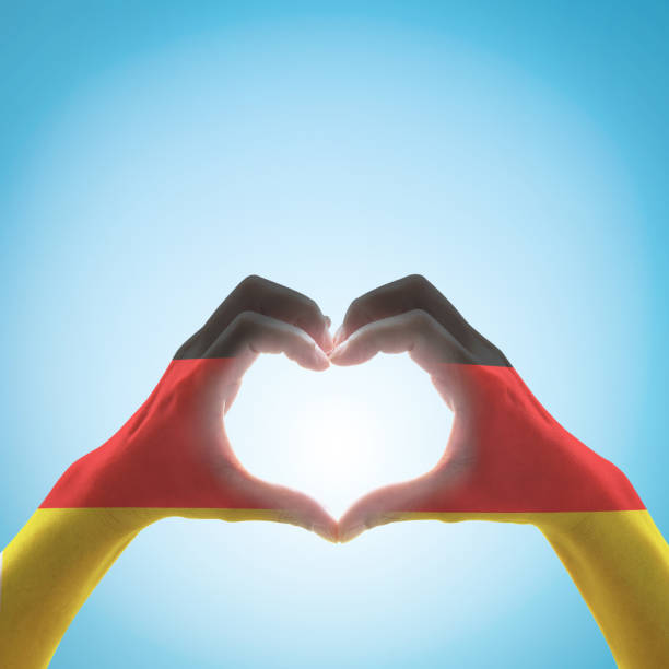 Germany national flag pattern on people heart shape hands.