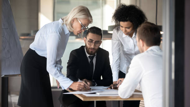 istock Diverse businesspeople cooperate brainstorming at team briefing 1197735192