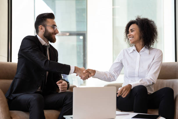 istock Multiracial business partners handshake get acquainted at meeting 1197735210