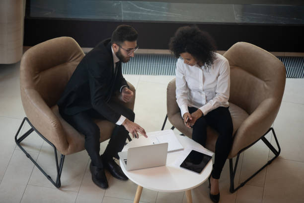 istock Diverse colleagues talk brainstorming working on laptop in office 1197735217