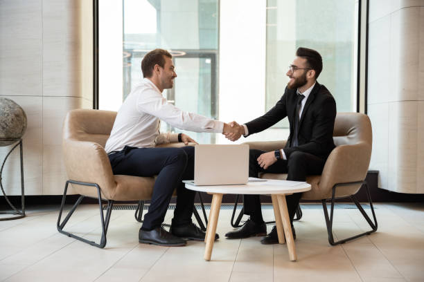istock Multiracial businessmen handshake getting acquainted at meeting 1197735219