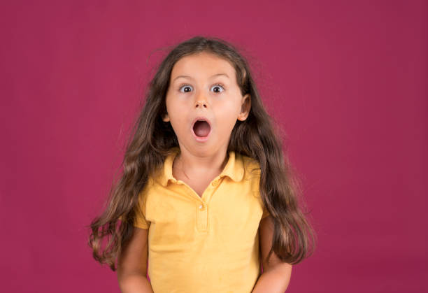 istock Cute little girl shouting with a surprised face expression 1197736106