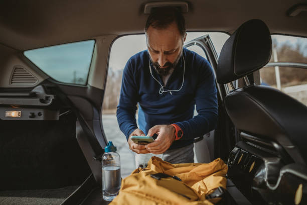 istock Senior man preparing mobile app for running 1197736136